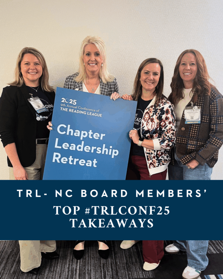 Four of TRL-NC's board members hold a sign from the Chapter Leader retreat.